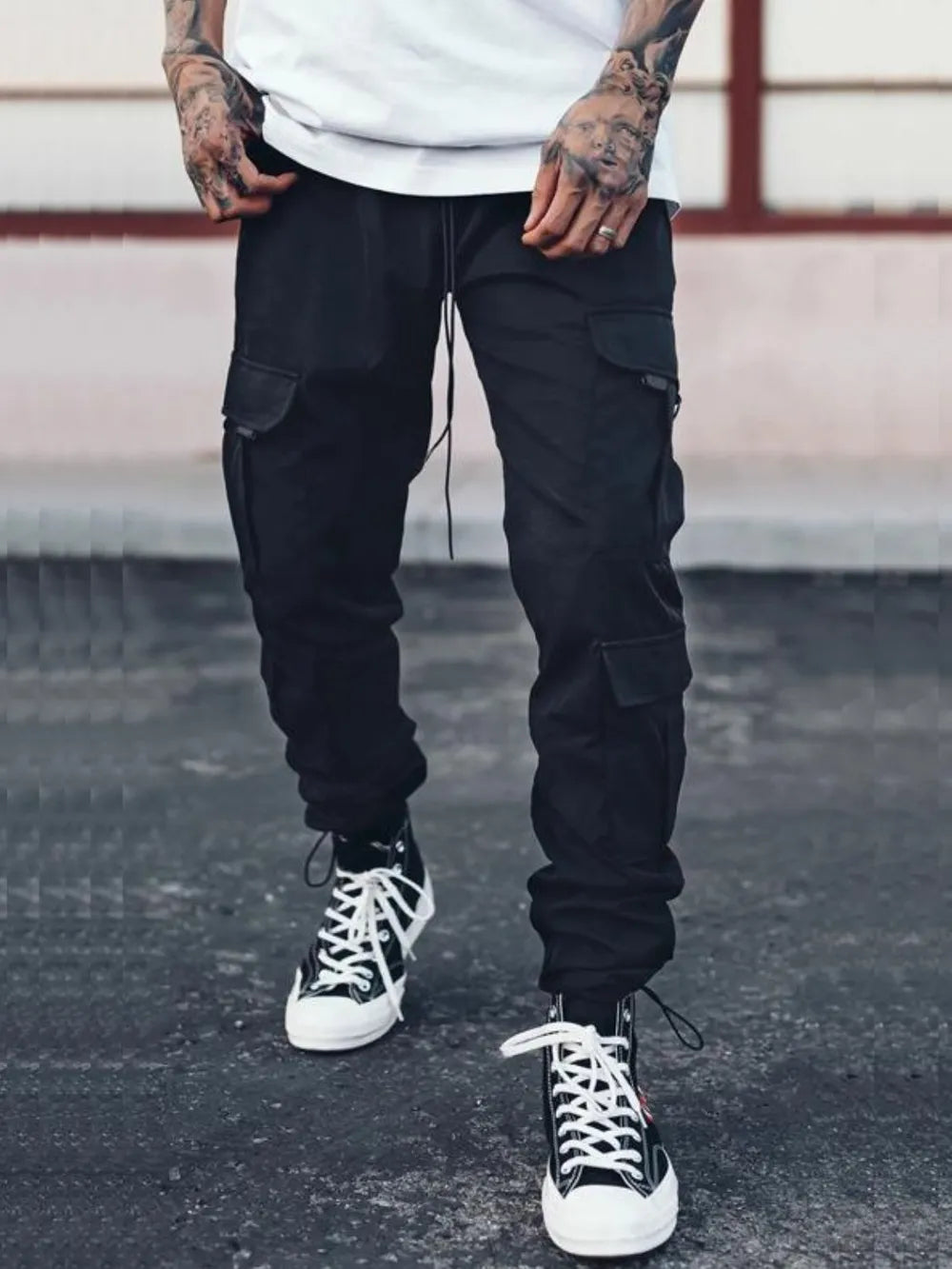 Black comfortable cargo pants for men with pockets and a relaxed fit, perfect for casual wear.