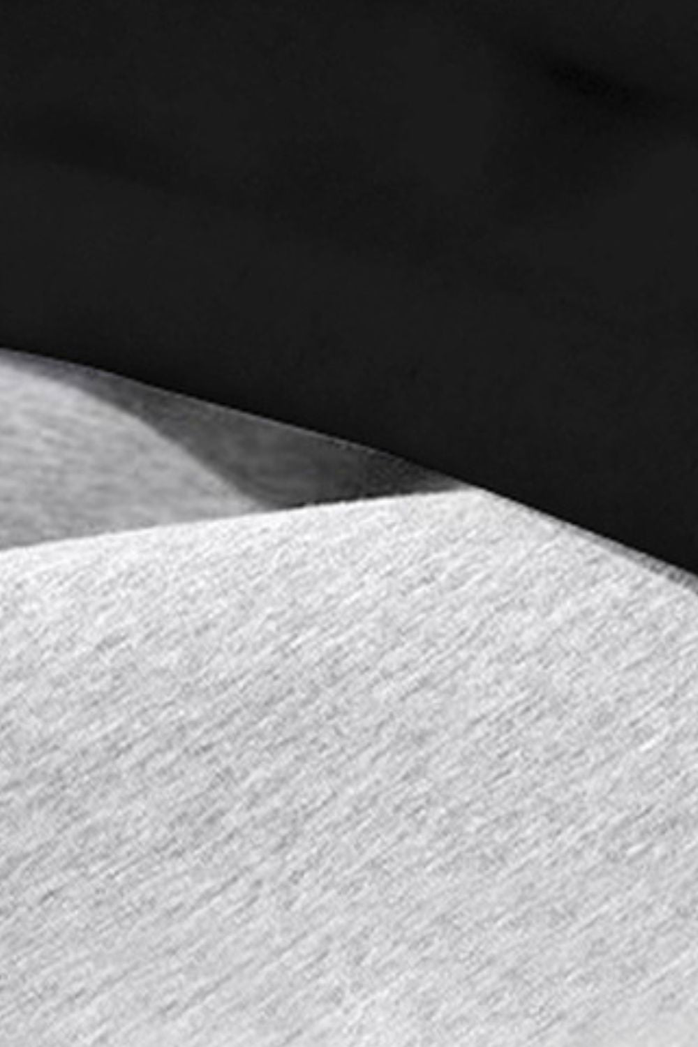 Trendsi men's drawstring sweatpants in light gray fabric showing a close-up texture detail