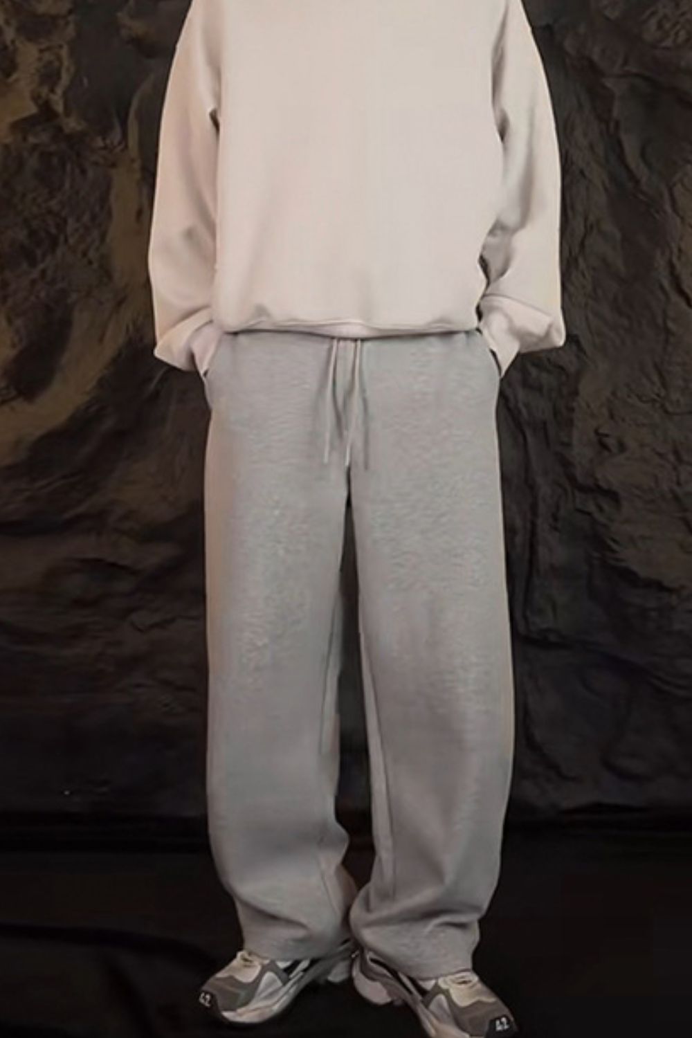 Men's drawstring sweatpants in light gray for comfortable casual wear with a relaxed fit