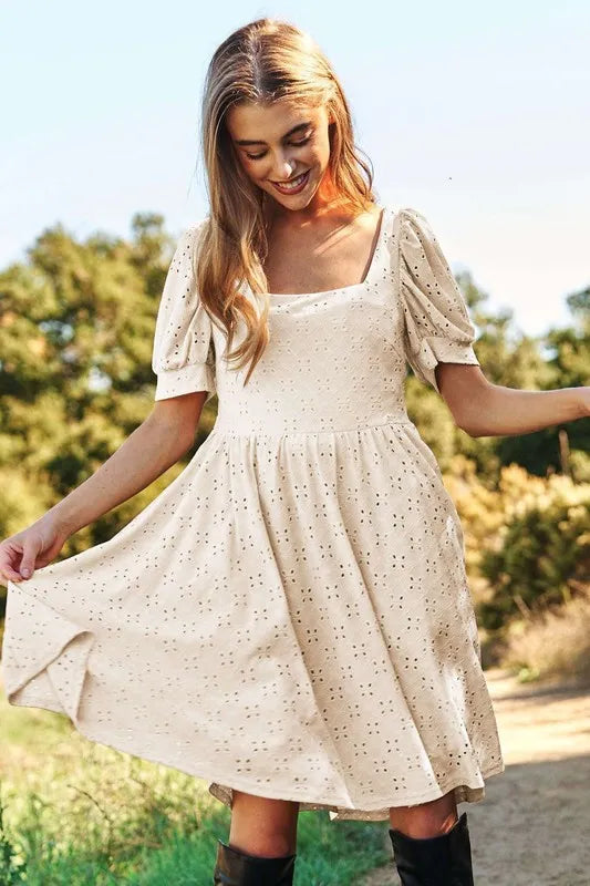Trendsi romantic eyelet baby doll dress in beige with puff sleeves for a flirty look