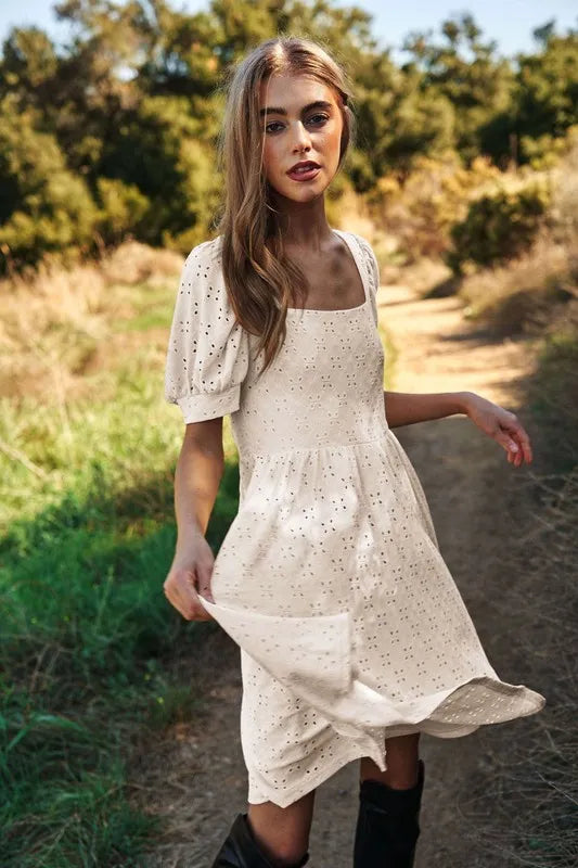 Trendsi romantic eyelet baby doll dress in cream with puff sleeves, perfect for summer outings