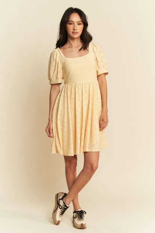 Trendsi romantic eyelet baby doll dress in yellow with puff sleeves and a flared skirt