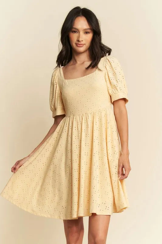 Trendsi romantic eyelet baby doll dress in soft yellow with puff sleeves and a flared skirt