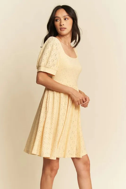 Trendsi romantic eyelet baby doll dress in yellow with short puff sleeves and a flared skirt