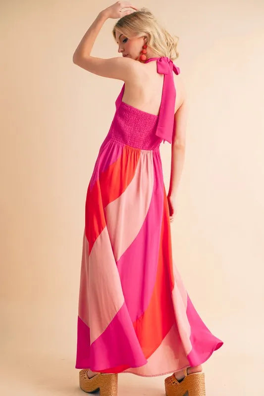 Stylish sleeveless color block maxi dress in vibrant pink hues with a bow tie detail