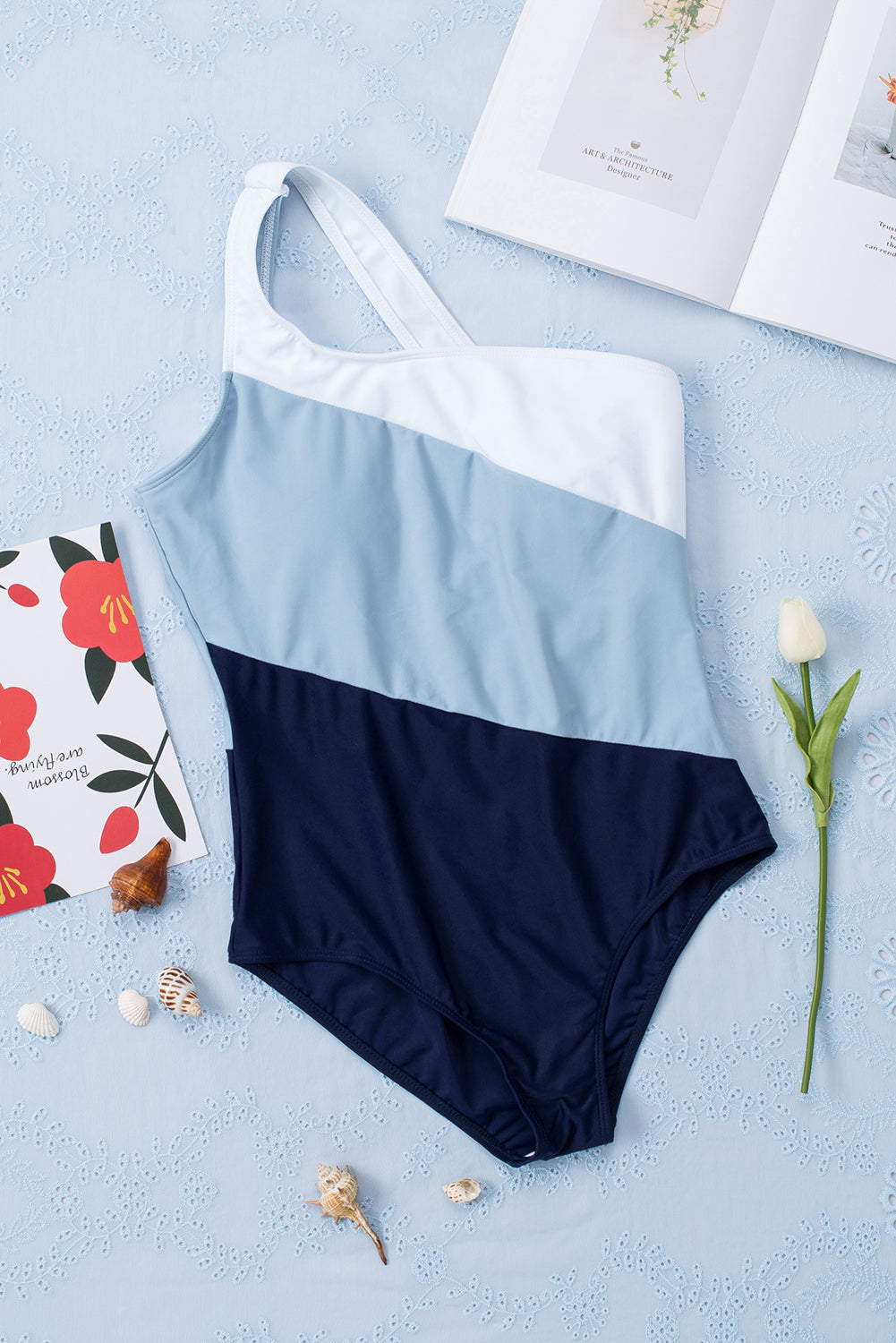 Stylish sleeveless full size swimsuit in blue and navy for beach and pool fun