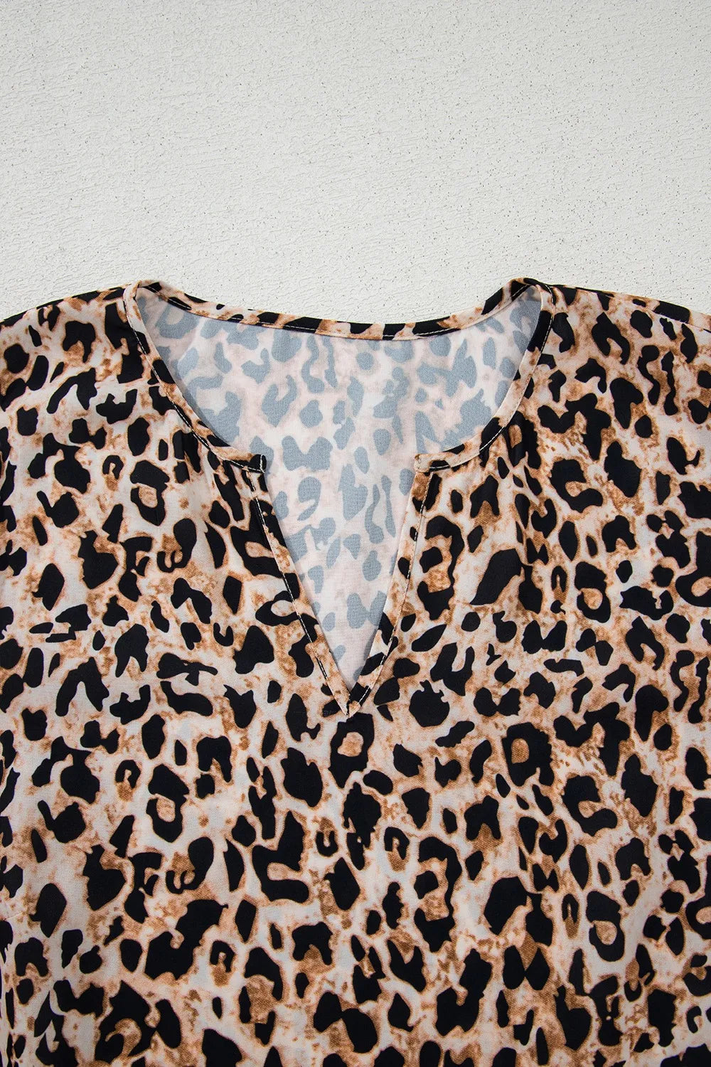 Trendsi stylish leopard print top with a flattering V-neck design and lightweight fabric