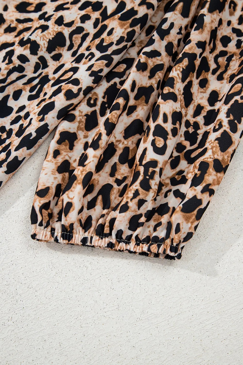 Trendsi stylish leopard print top featuring a loose fit and gathered cuffs for a trendy look
