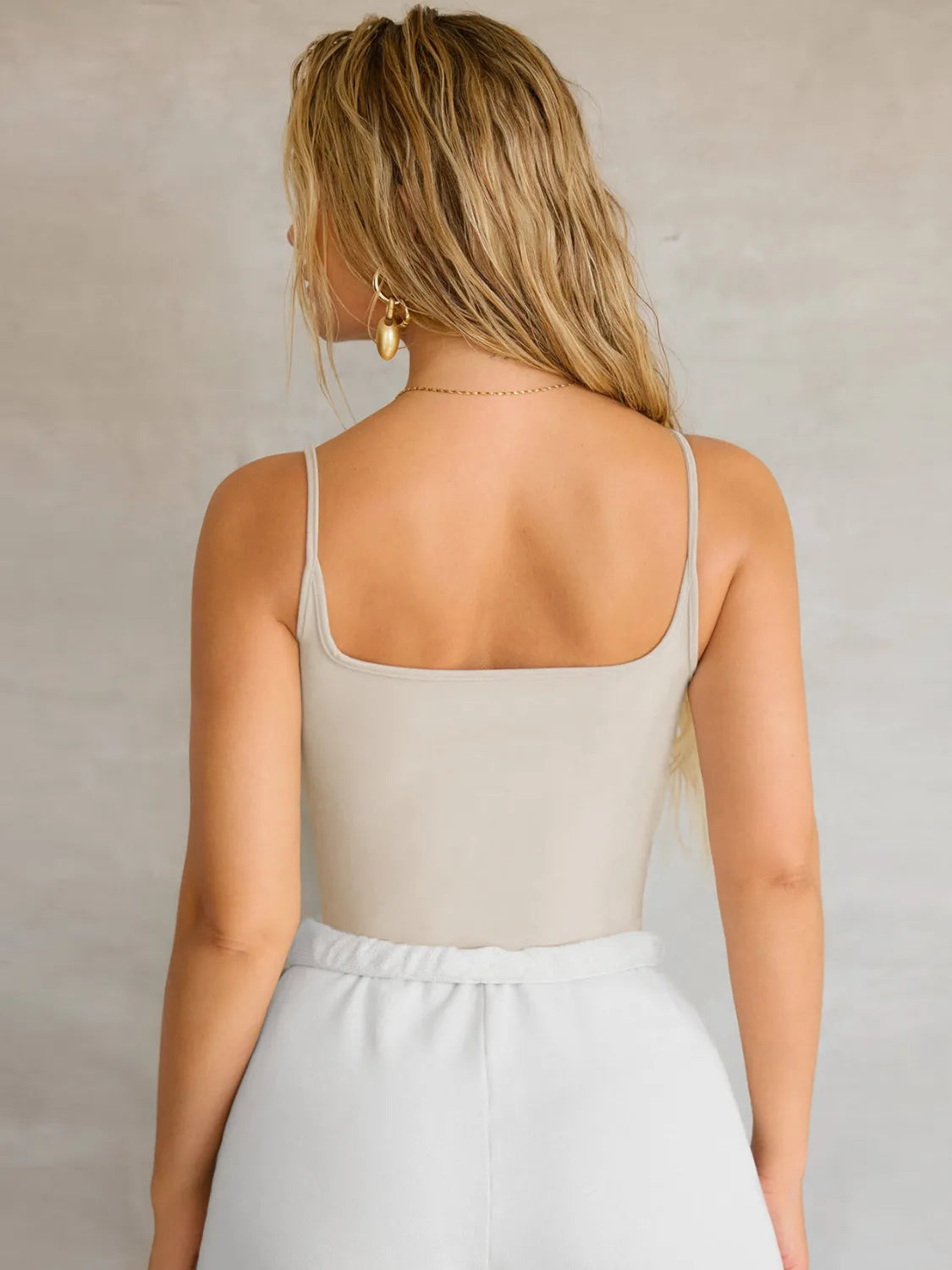 Back view of a stylish 2 piece cami outfit featuring a fitted top and soft bottoms