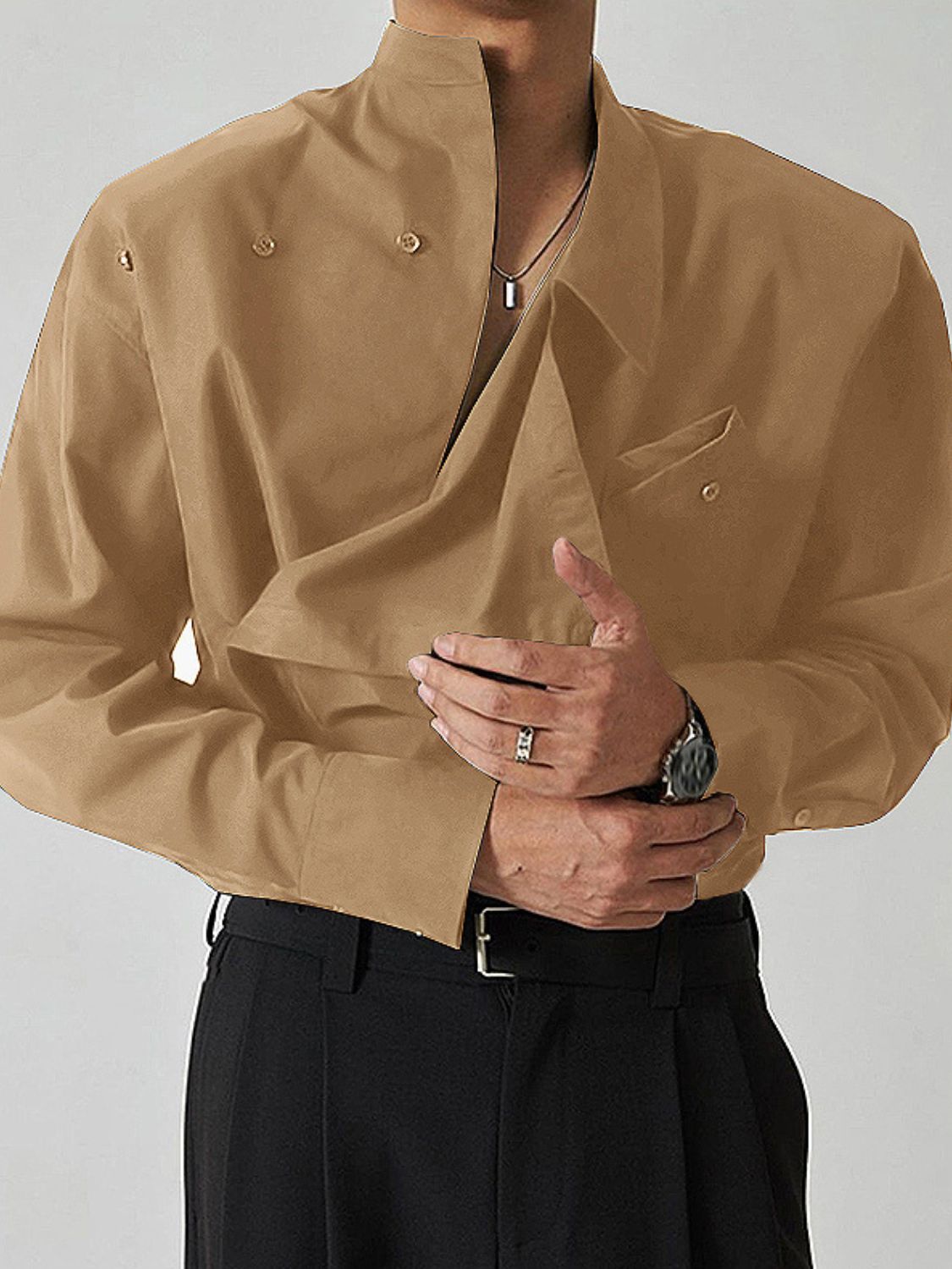 asymmetrical long sleeve shirt in beige with unique design and tailored fit for a modern look