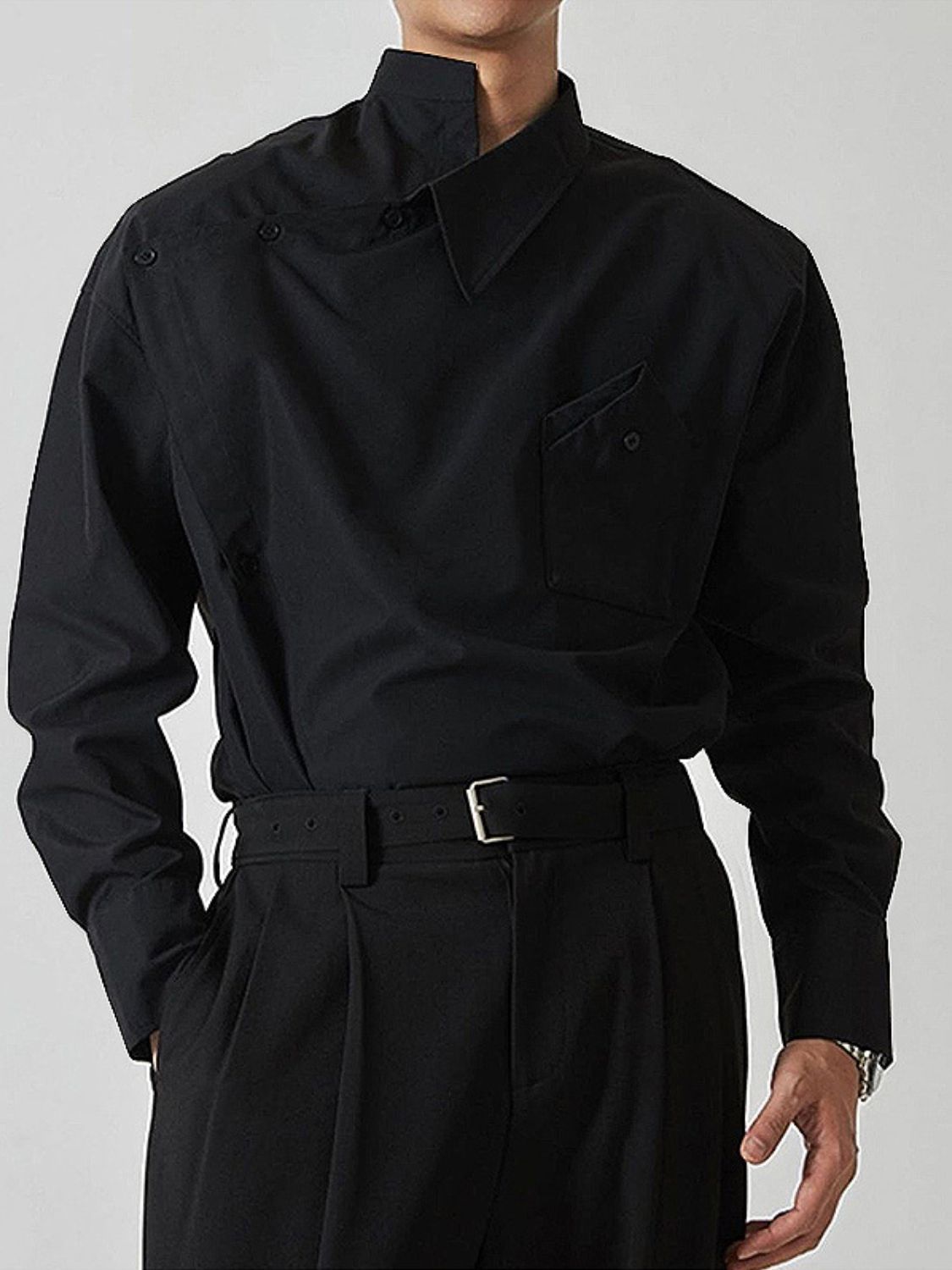asymmetrical long sleeve shirt in black featuring a unique collar and pocket detail