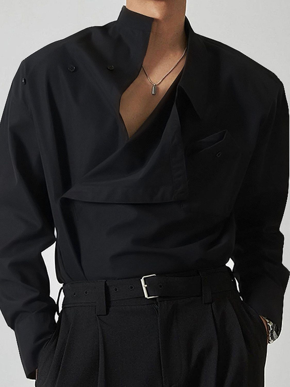 asymmetrical long sleeve shirt in black with a stylish open collar and front pocket detail