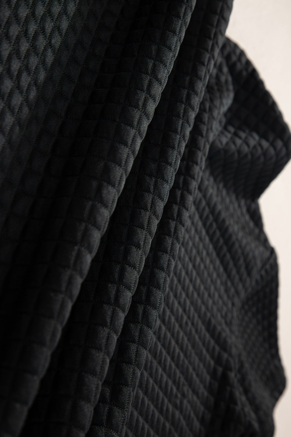 Textured black fabric showcasing a stylish casual summer outfit for comfortable wear