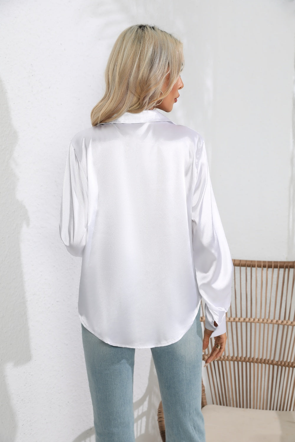 Model wearing a Lapel Collar Long Sleeve Shirt in white, showcasing the elegant back design
