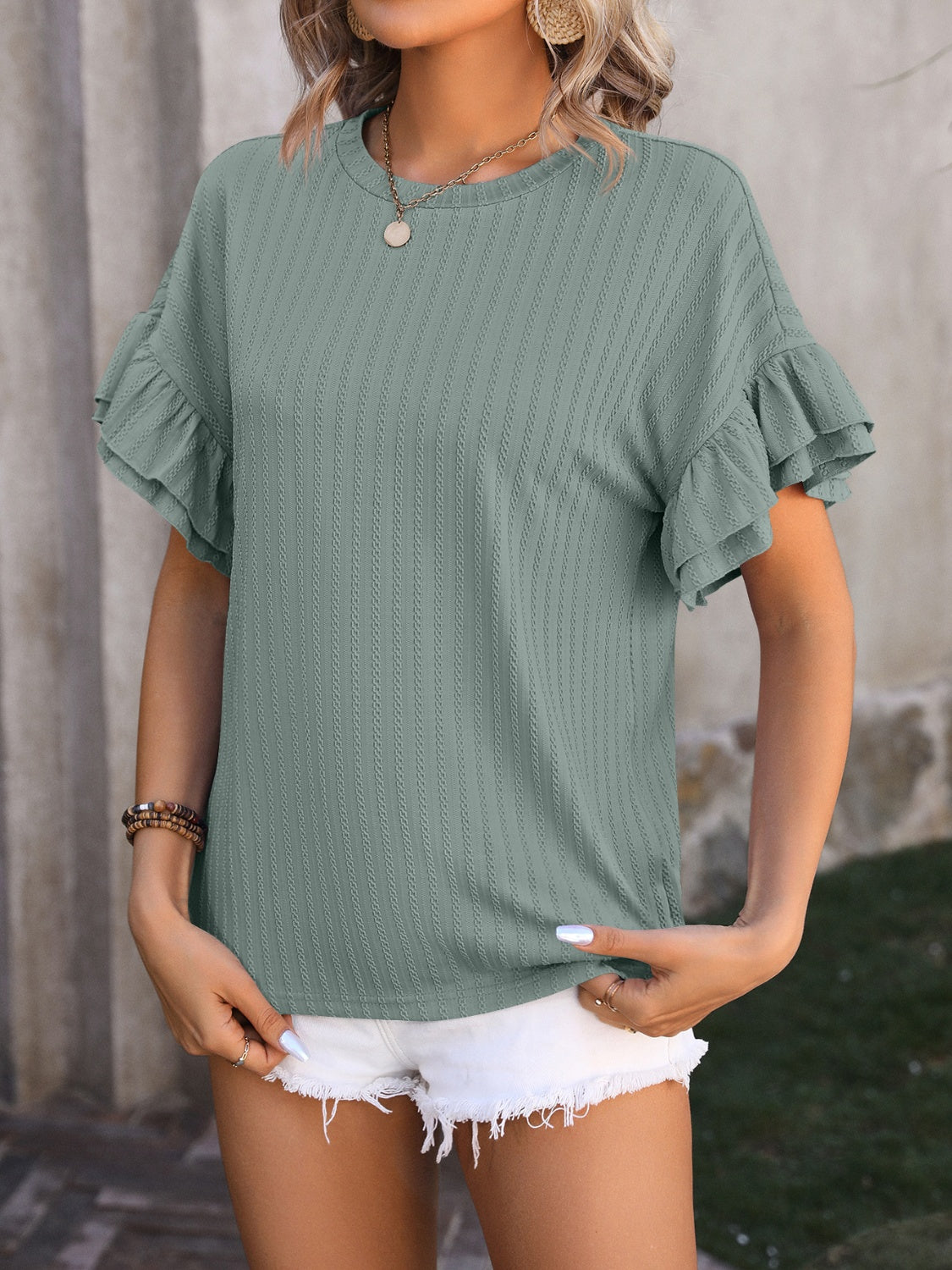 Trendsi ruffled short sleeve blouse in green with textured fabric and relaxed fit