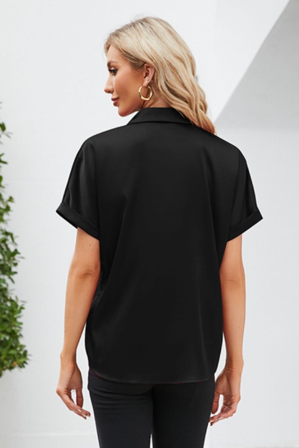 short sleeve casual shirt in black, featuring a relaxed fit and roll-up sleeves