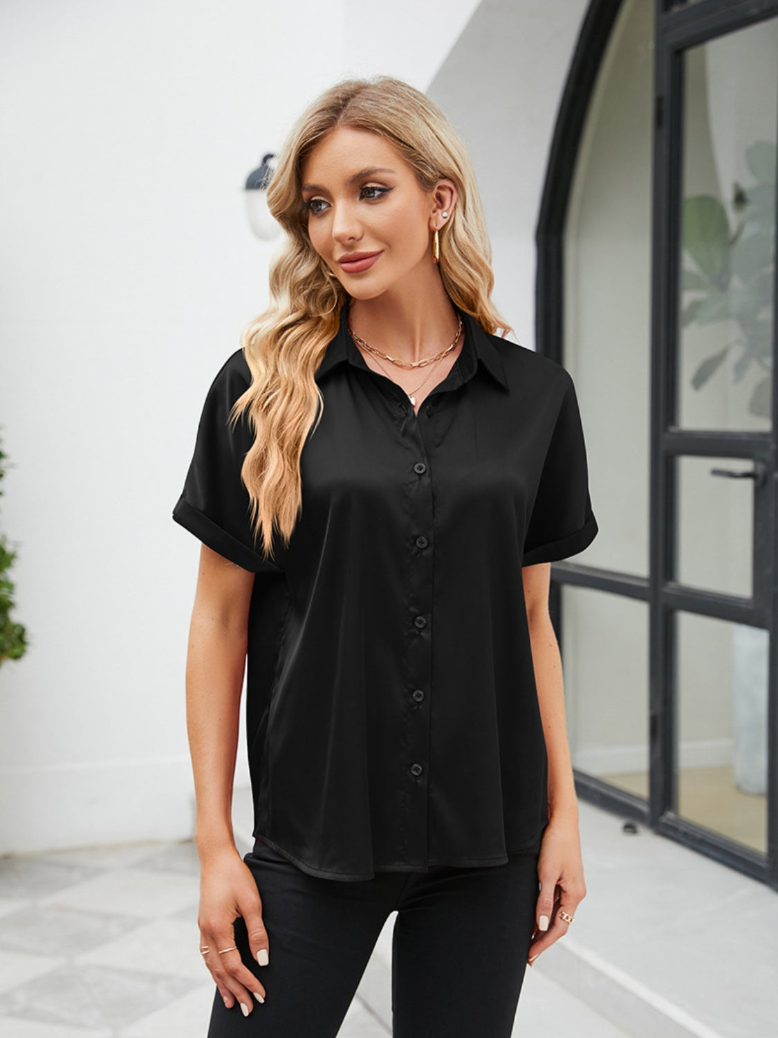 short sleeve casual shirt in black with a relaxed fit and button details