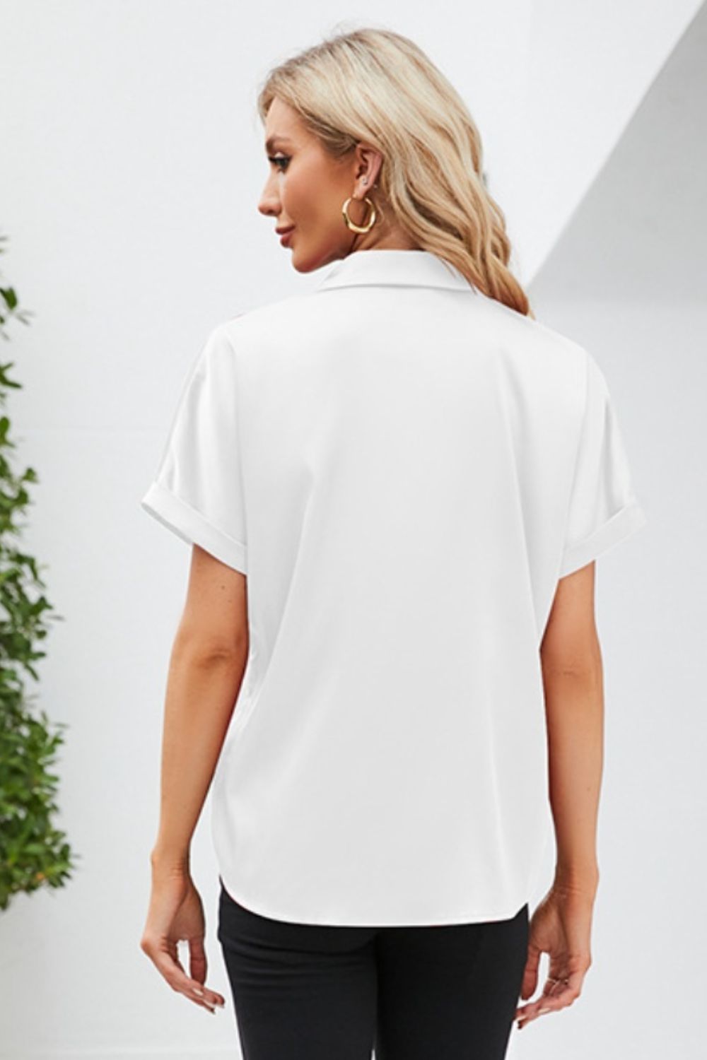 Back view of a white short sleeve casual shirt from Trendsi, perfect for everyday wear